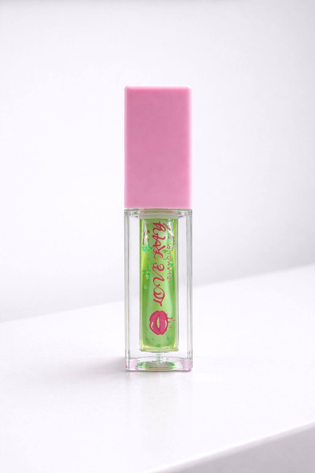 Apple Pop lip gloss with green apple flavor and playful pink cap, perfect for tiny hands.